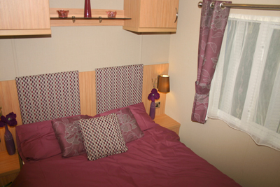 A double bed is standard in the main bedroom