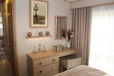 ABI Roxbury holiday home - The dressing table and stool in the master bedroom.