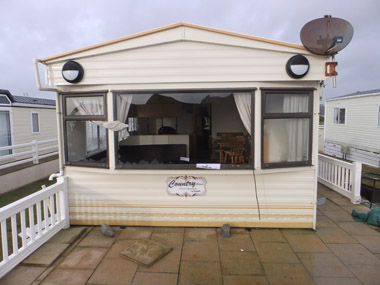 Severe damage to this static caravan's exterior