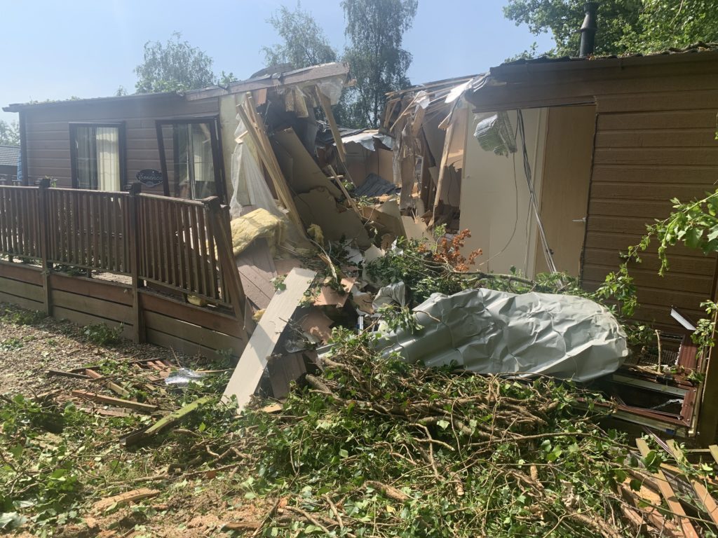 damaged static caravan fallen tree