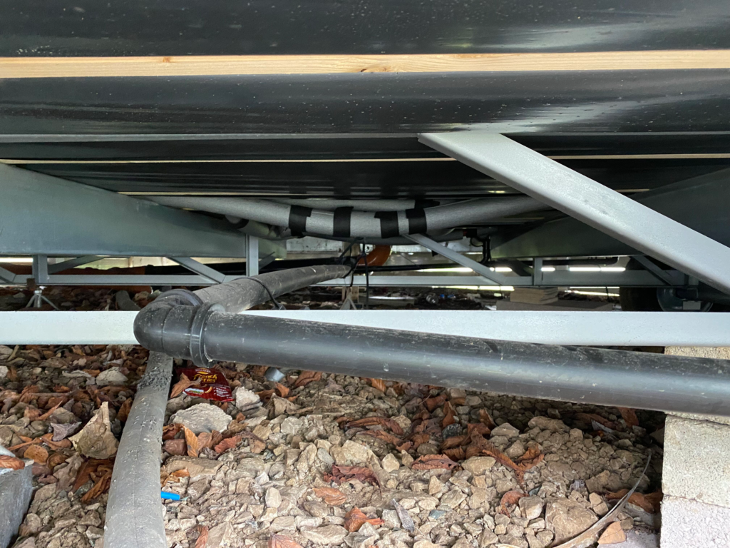 spring checks underside of static caravan