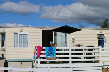 Keeping cool under patio umbrella at static caravan