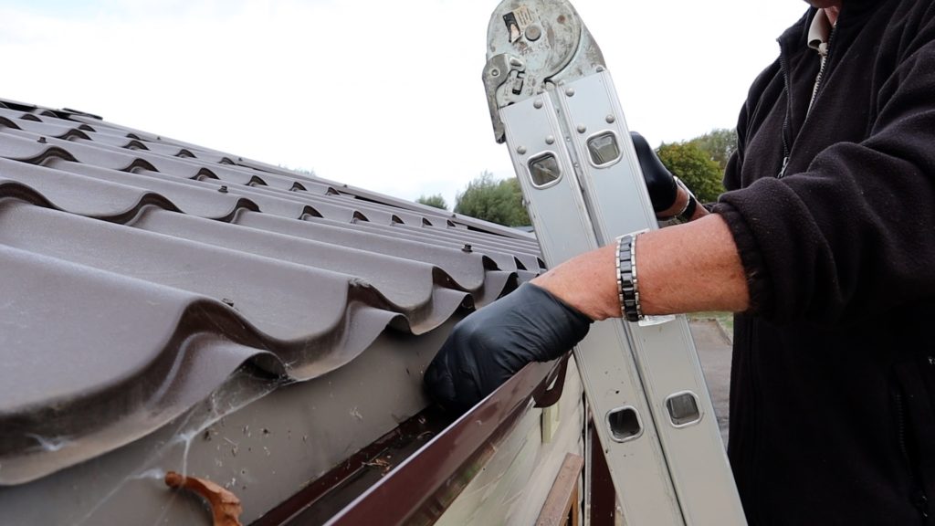 Static caravan cleaning gutters