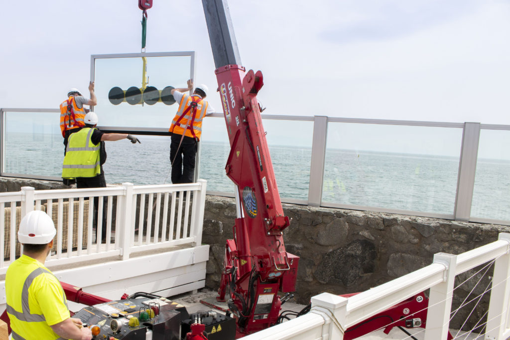 Glass wave wall being installed at Gimblet Rock