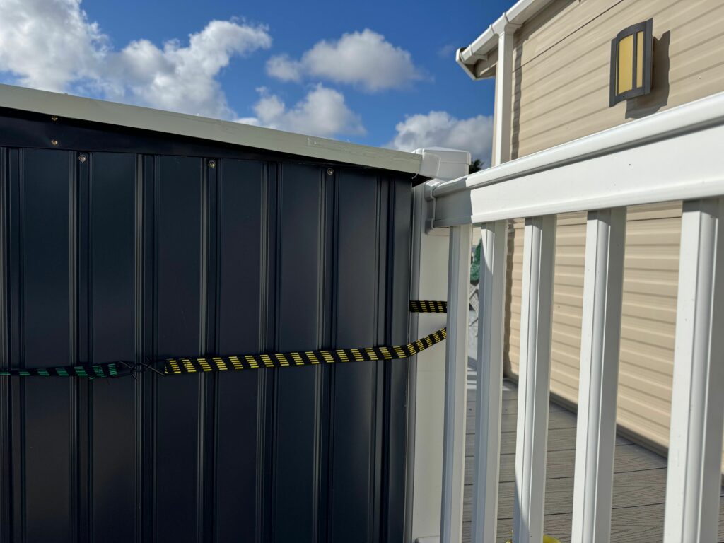 strap shed down