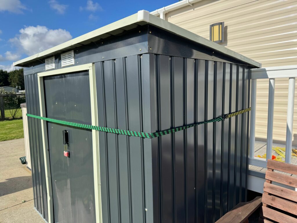 strap shed down